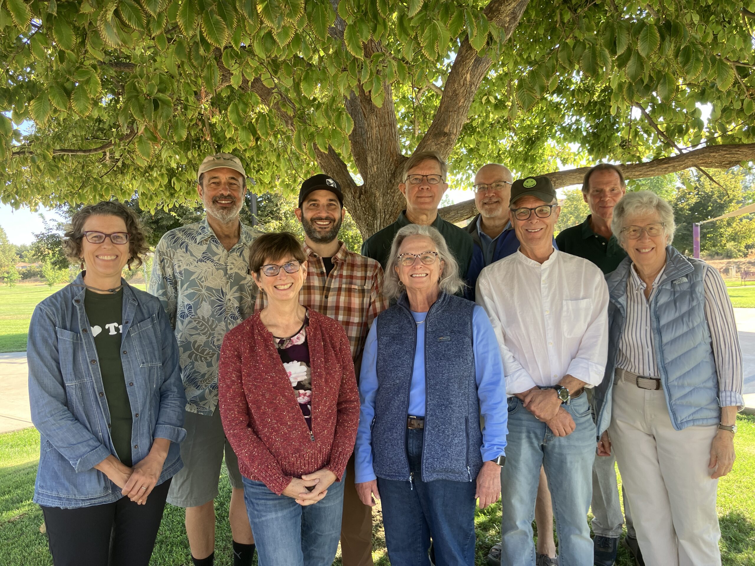 Board members smile and pose for photo.