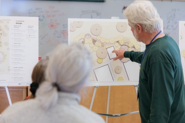Community member views planting plans for the school campus.