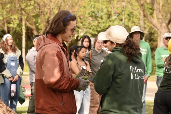Two people chat at volunteer event.